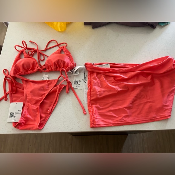 Satin pink sparkly 2 piece bathing suit with a matching cover-up skirt. - Picture 1 of 4